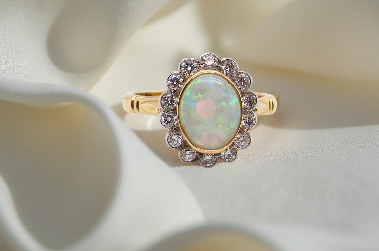 A White Opal and Diamond engagement ring