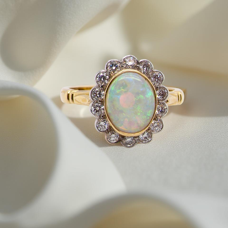 A White Opal and Diamond engagement ring
