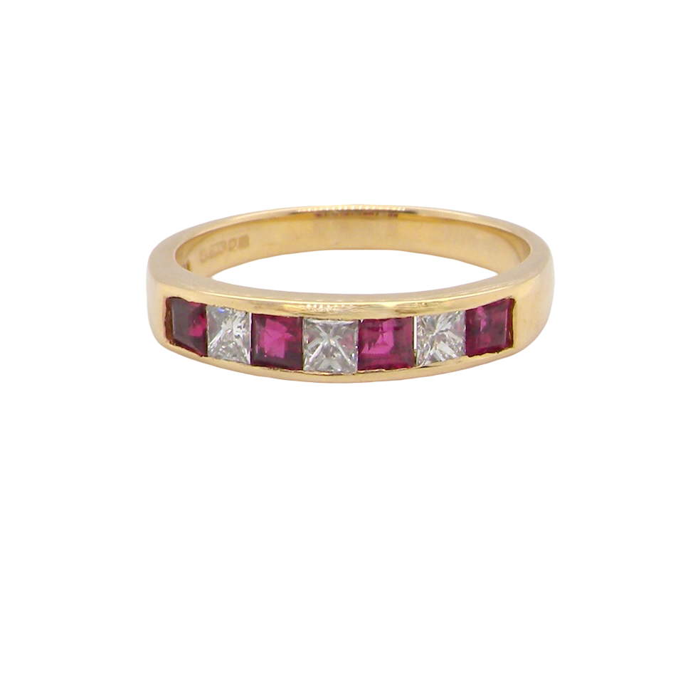 A beautiful 18-carat gold half-hoop eternity ring set with alternating rubies and diamonds.