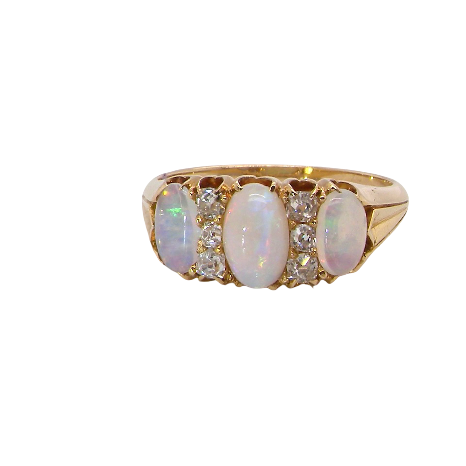 A beautiful Victorian dress ring, set with three finely matched oval opals,
