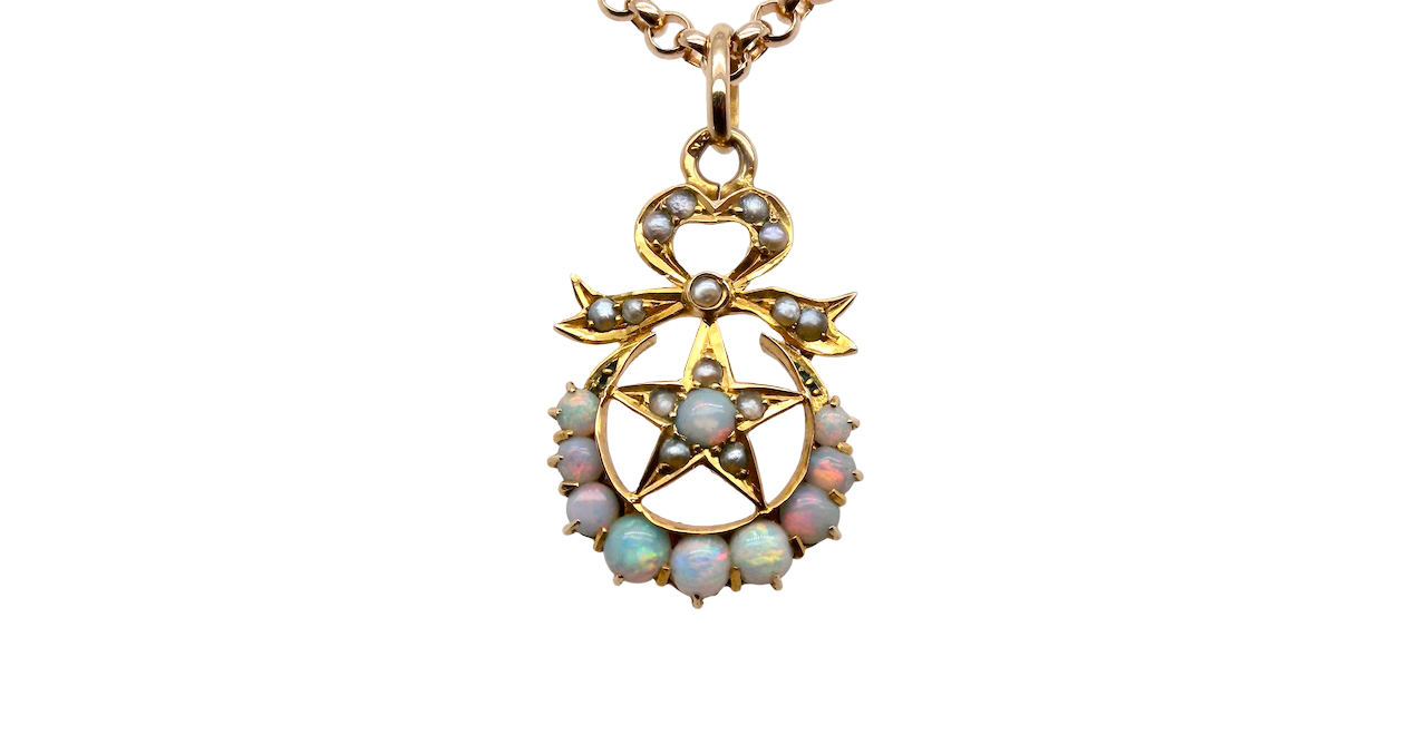 A beautiful antique Victorian pendant featuring opals and pearls.