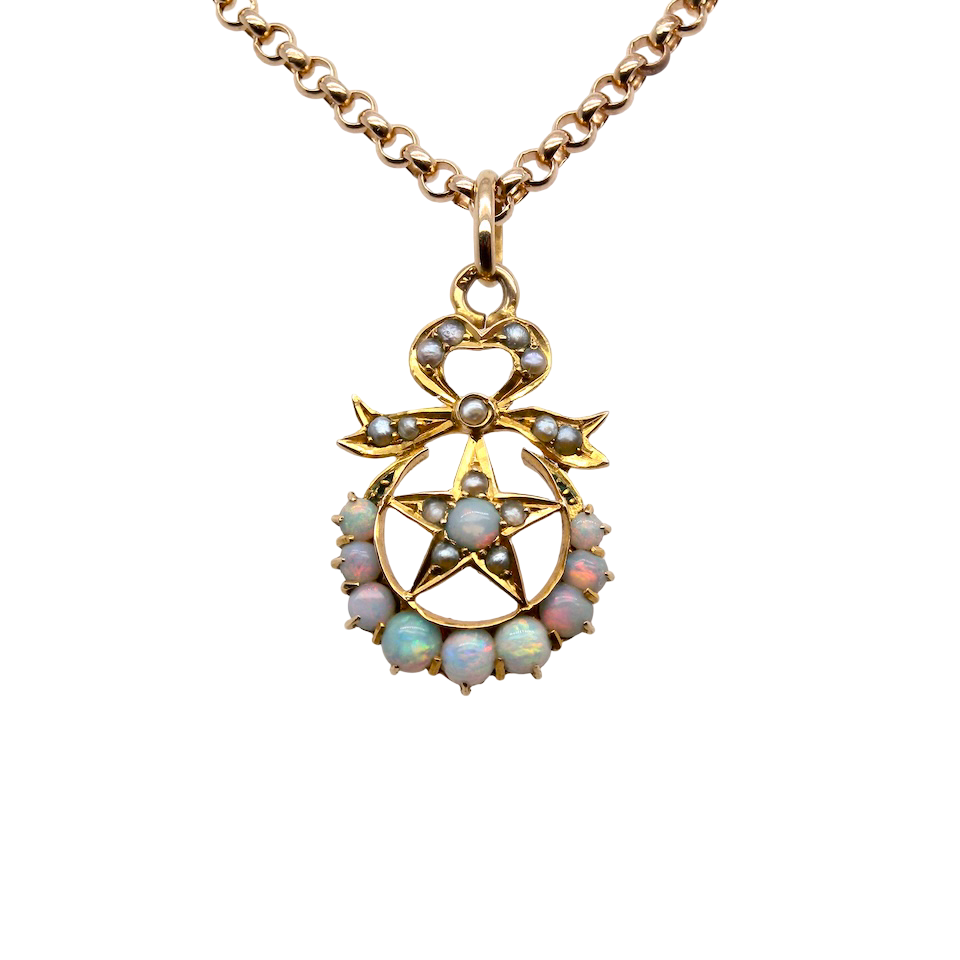 A beautiful antique Victorian pendant featuring opals and pearls.