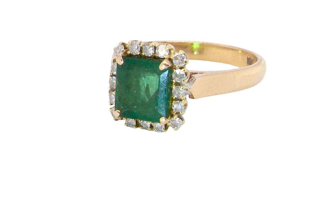 A beautiful cluster ring set with a large square-cut emerald measuring approximately 7 x 7mm, displaying a deep grass-green colour