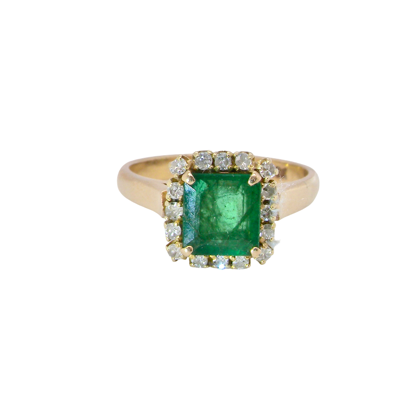 A beautiful cluster ring set with a large square-cut emerald measuring approximately 7 x 7mm, displaying a deep grass-green colour with natural inclusions, as expected in emeralds.