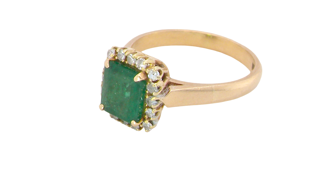 A beautiful cluster ring set with a large square-cut emerald measuring approximately 7 x 7mm, displaying a deep grass-green colour with natural inclusions, as expected in emeralds. side