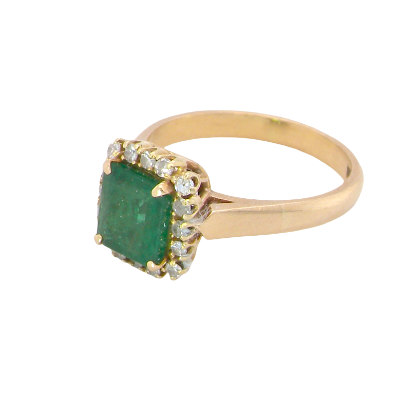 A beautiful cluster ring set with a large square-cut emerald measuring approximately 7 x 7mm, displaying a deep grass-green colour with natural inclusions, as expected in emeralds. side