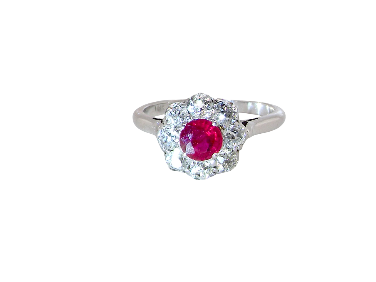 A beautiful cluster ring set with a raspberry-red ruby centre stone measuring 5mm in diameter,