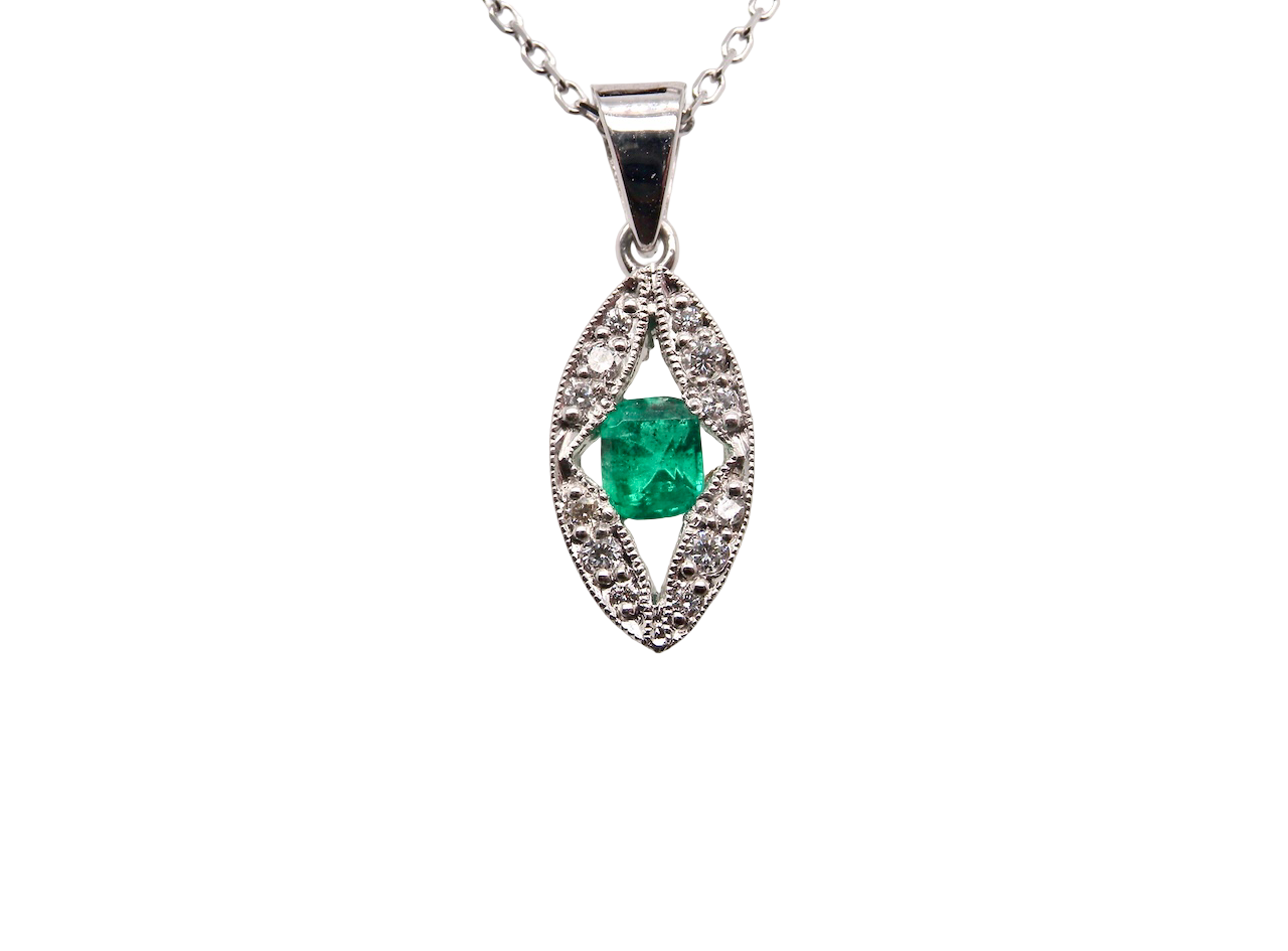 A beautiful modern 18ct white gold pendant featuring a cushion-cut emerald measuring approximately 4 x 3.5mm , displaying a rich deep grass-green hue.