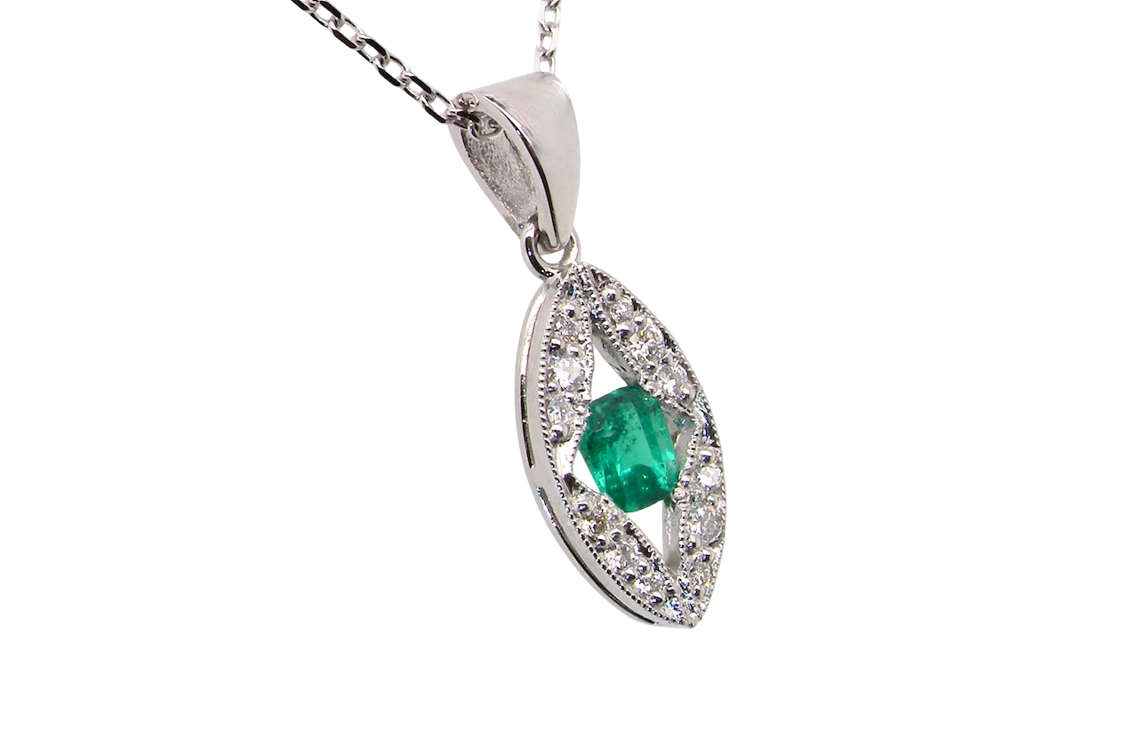 A beautiful modern 18ct white gold pendant featuring a cushion-cut emerald measuring approximately 4 x 3.5mm (estimated 0.35 carat),