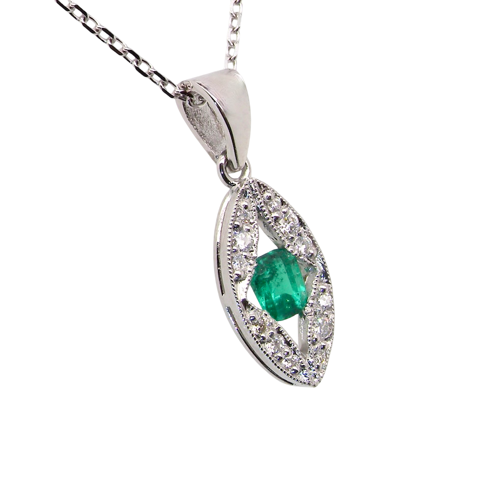A beautiful modern 18ct white gold pendant featuring a cushion-cut emerald measuring approximately 4 x 3.5mm (estimated 0.35 carat),