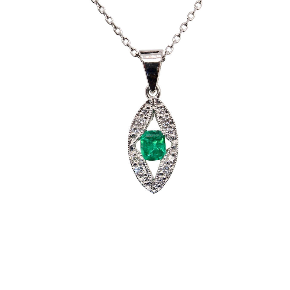 A beautiful modern 18ct white gold pendant featuring a cushion-cut emerald measuring approximately 4 x 3.5mm (estimated 0.35 carat), displaying a rich deep grass-green hue.