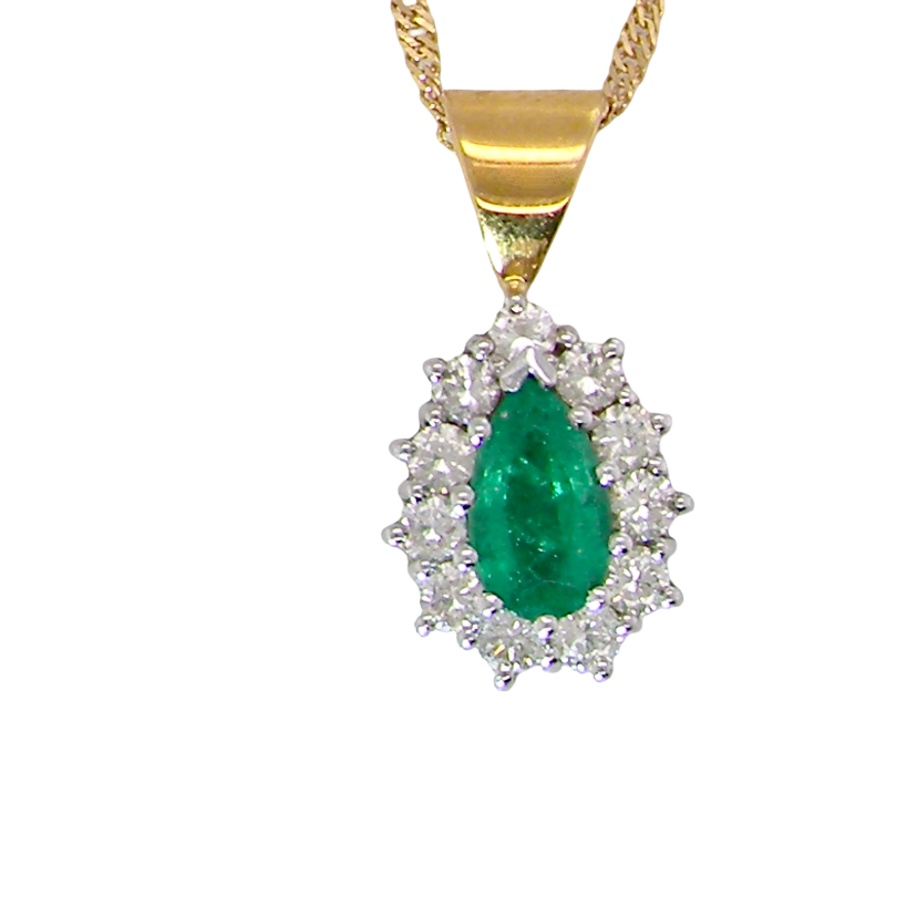 A gold pendant necklace featuring a pear-cut green emerald center stone surrounded by a halo of small clear stones, suspended from a gold chain against a plain white background.