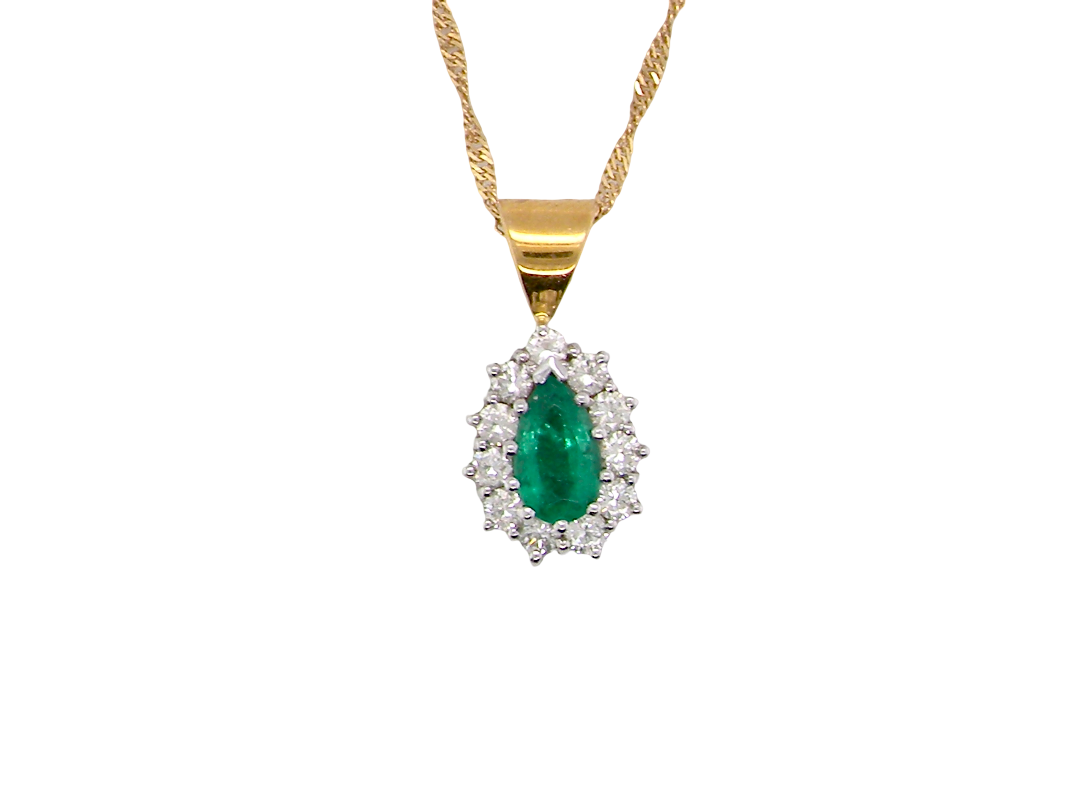 A beautiful pear shaped pendant. The emerald measures 7x5mm (0.75 carats est), good deep grass green colour.