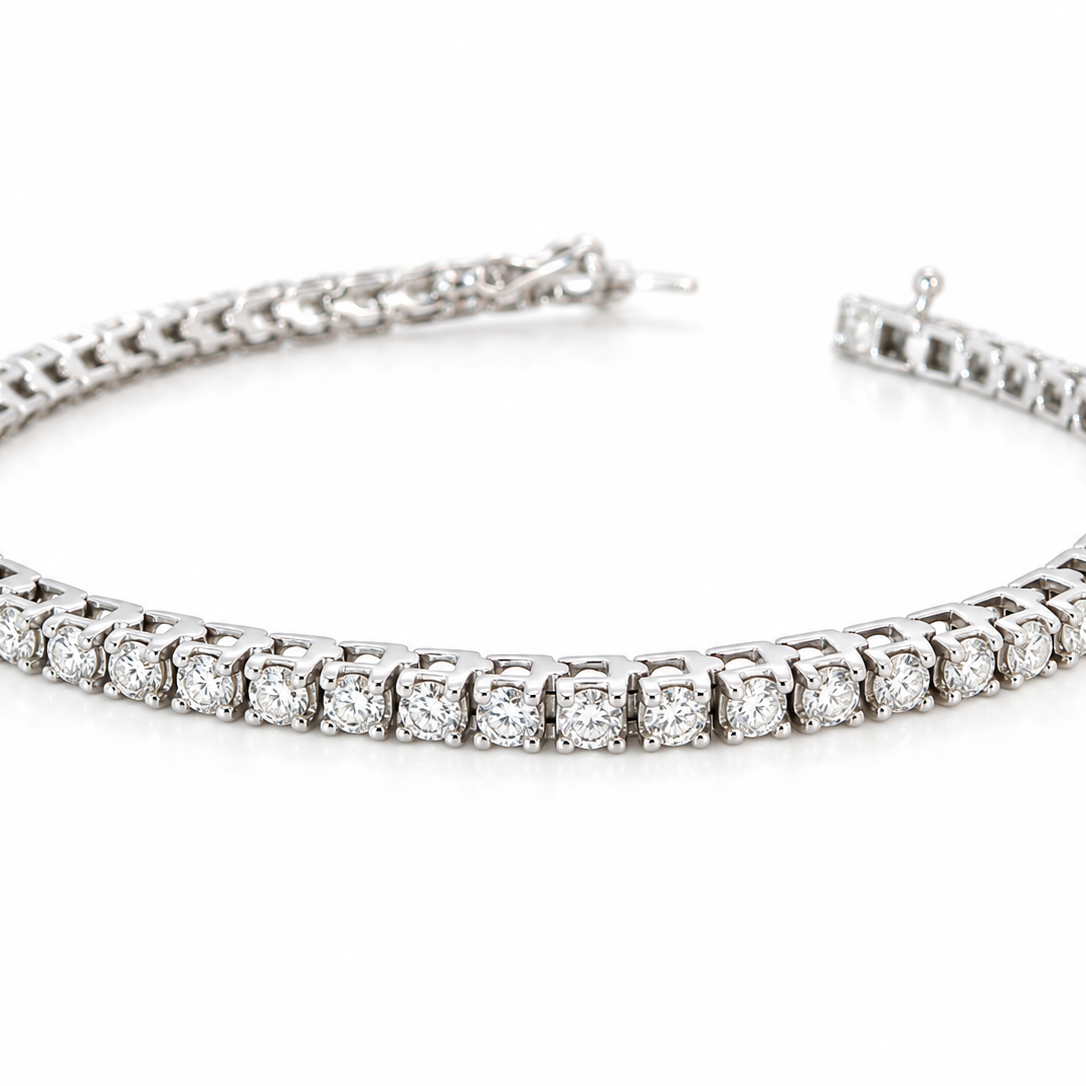 A beautiful tennis bracelet set with approximately sixty brilliant cut white diamonds to a total carat weight estimated at 3.50 carats.