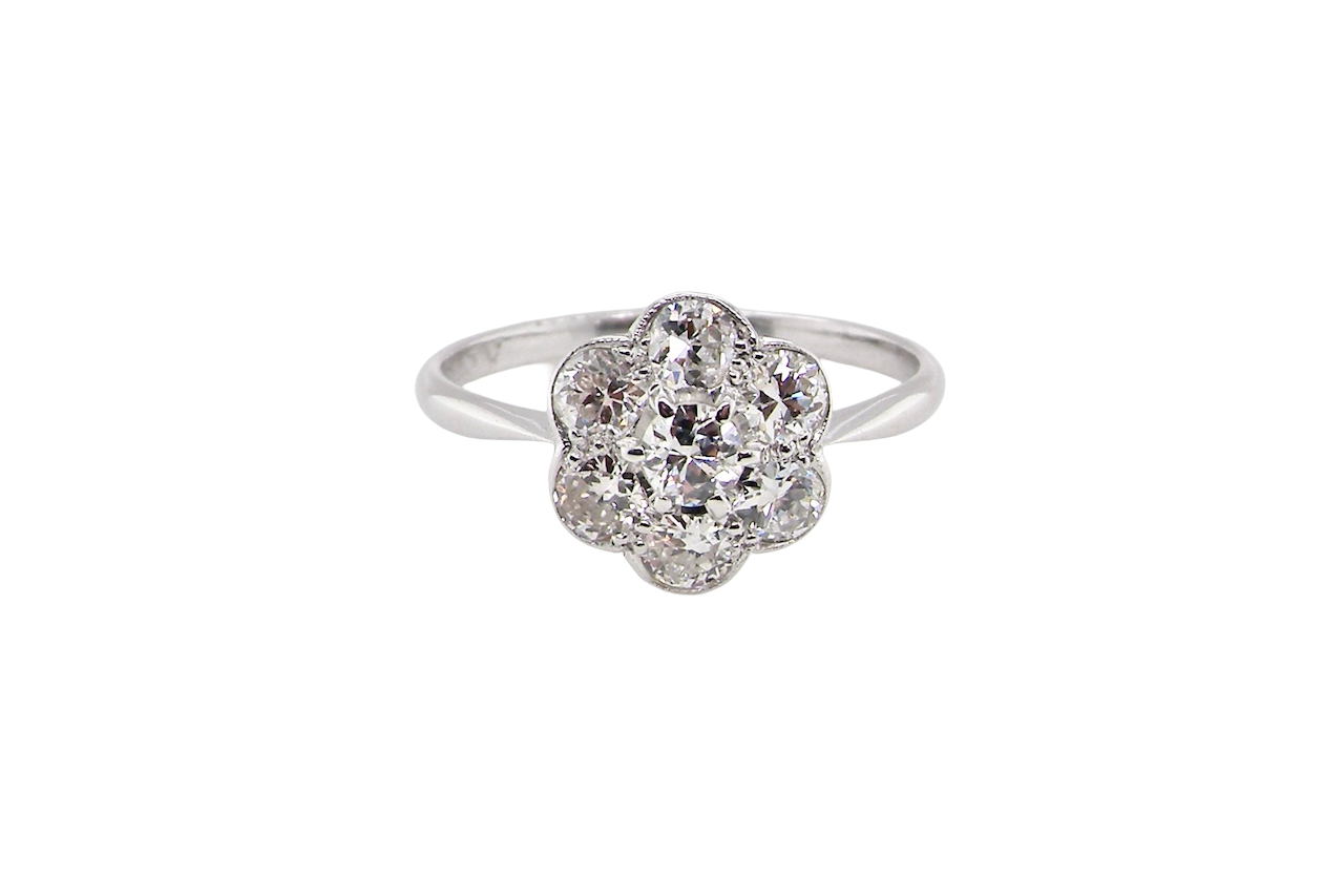 Diamond ring with floral design on a white background