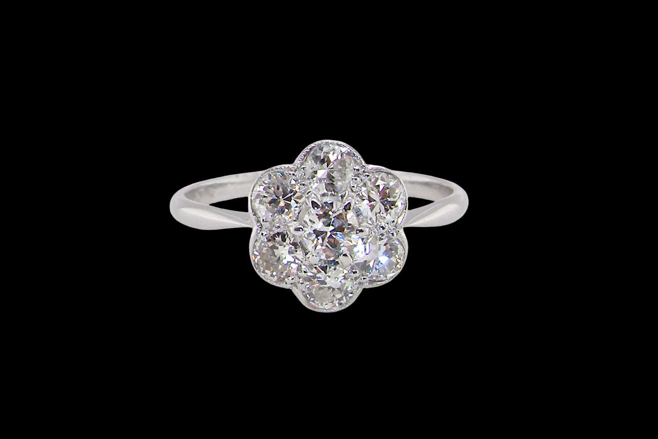 Diamond ring with floral design on a black background