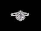 Diamond ring with floral design on a black background
