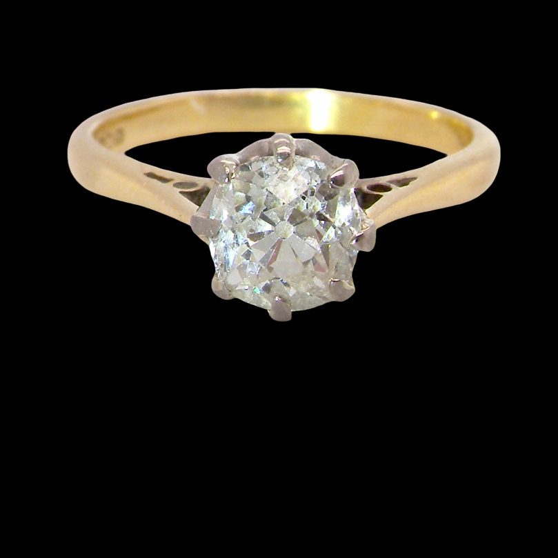 A beautiful vintage diamond solitaire ring featuring an old brilliant cut white diamond measuring approximately 6mm, estimated at 0.75 carats. The diamond displays attractive sparkle with an assessed colour