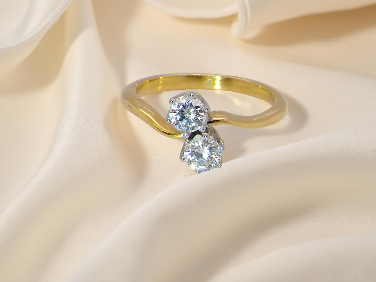 A beautifully balanced Moi et Toi ring featuring two modern brilliant-cut diamonds