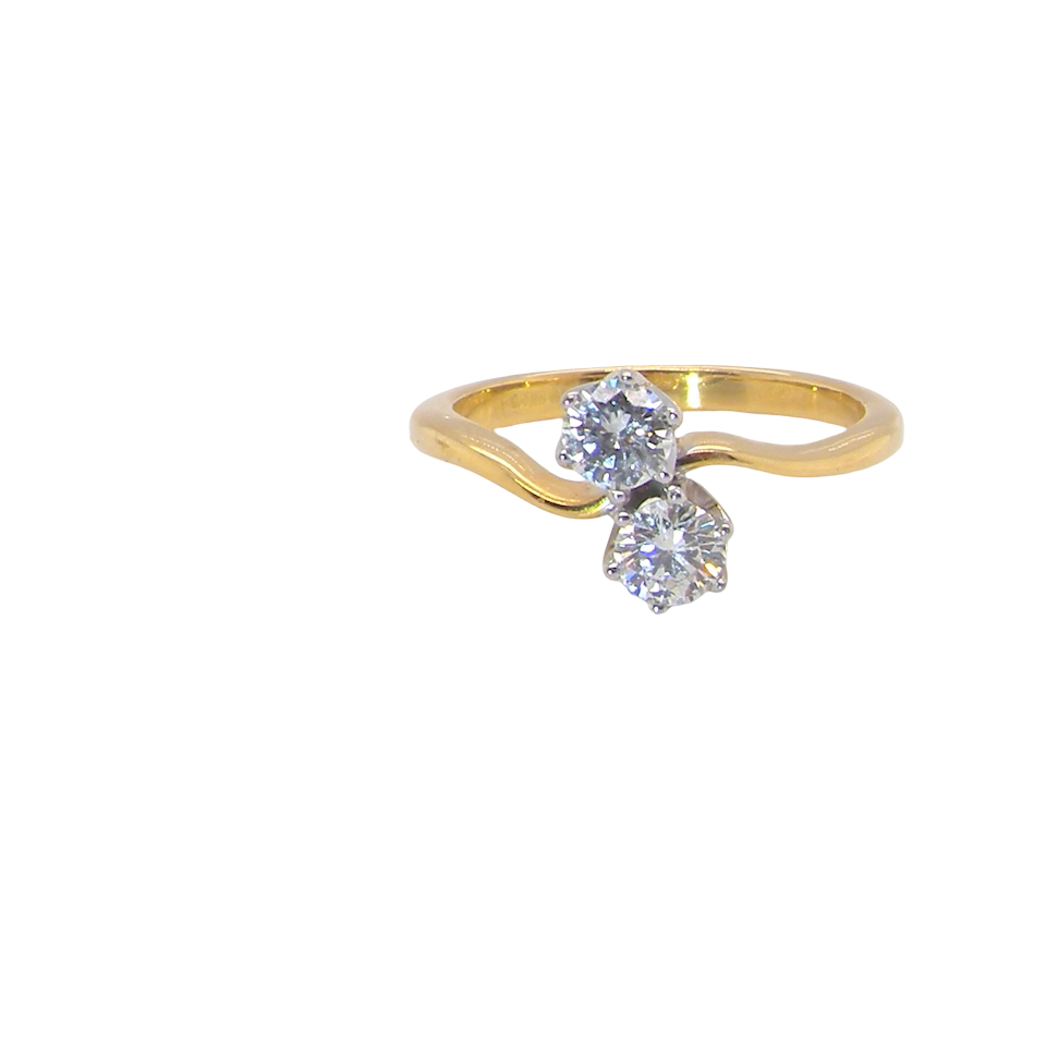 A beautifully balanced Moi et Toi ring featuring two sparkling modern brilliant-cut diamonds