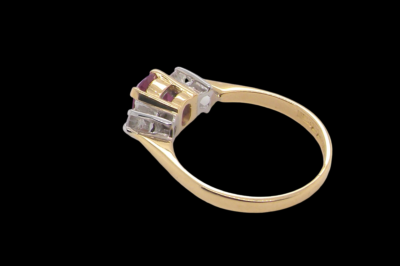A beautifully crafted vintage ruby trilogy ring in rich 18-carat gold side