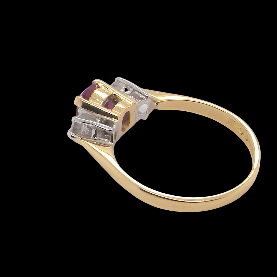 A beautifully crafted vintage ruby trilogy ring in rich 18-carat gold side