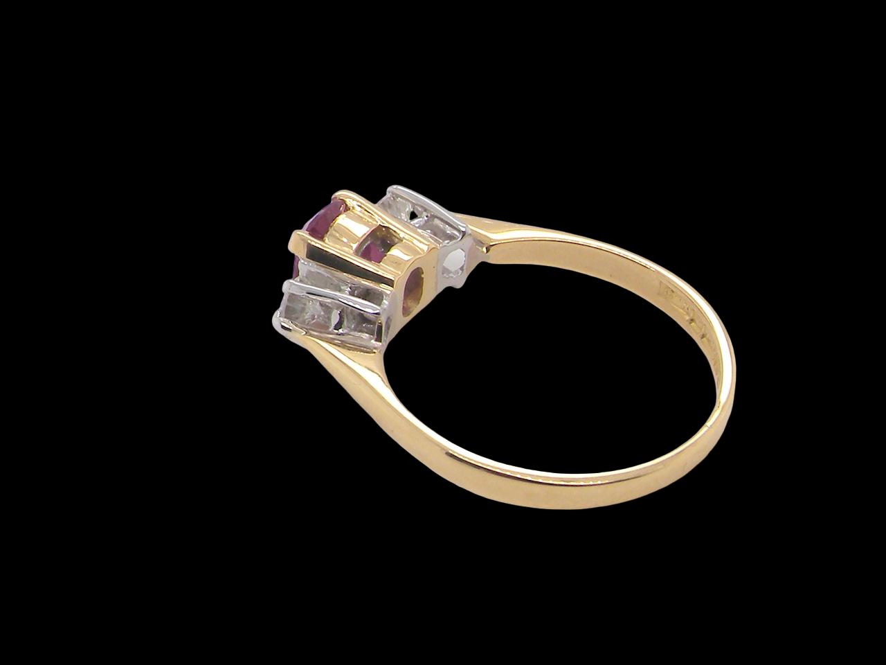 A beautifully crafted vintage ruby trilogy ring in rich 18-carat gold side