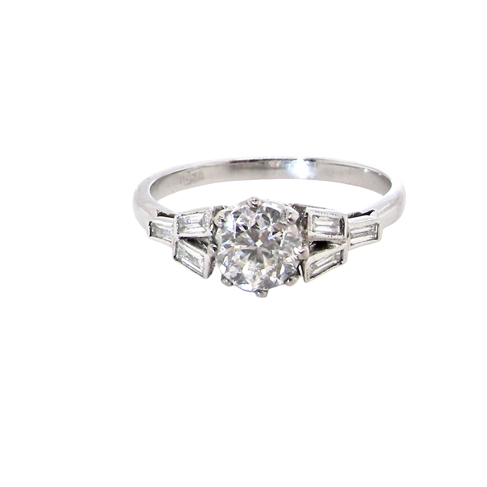 A beautifully proportioned Art Deco solitaire ring showcasing a sparkling old brilliant cut white diamond