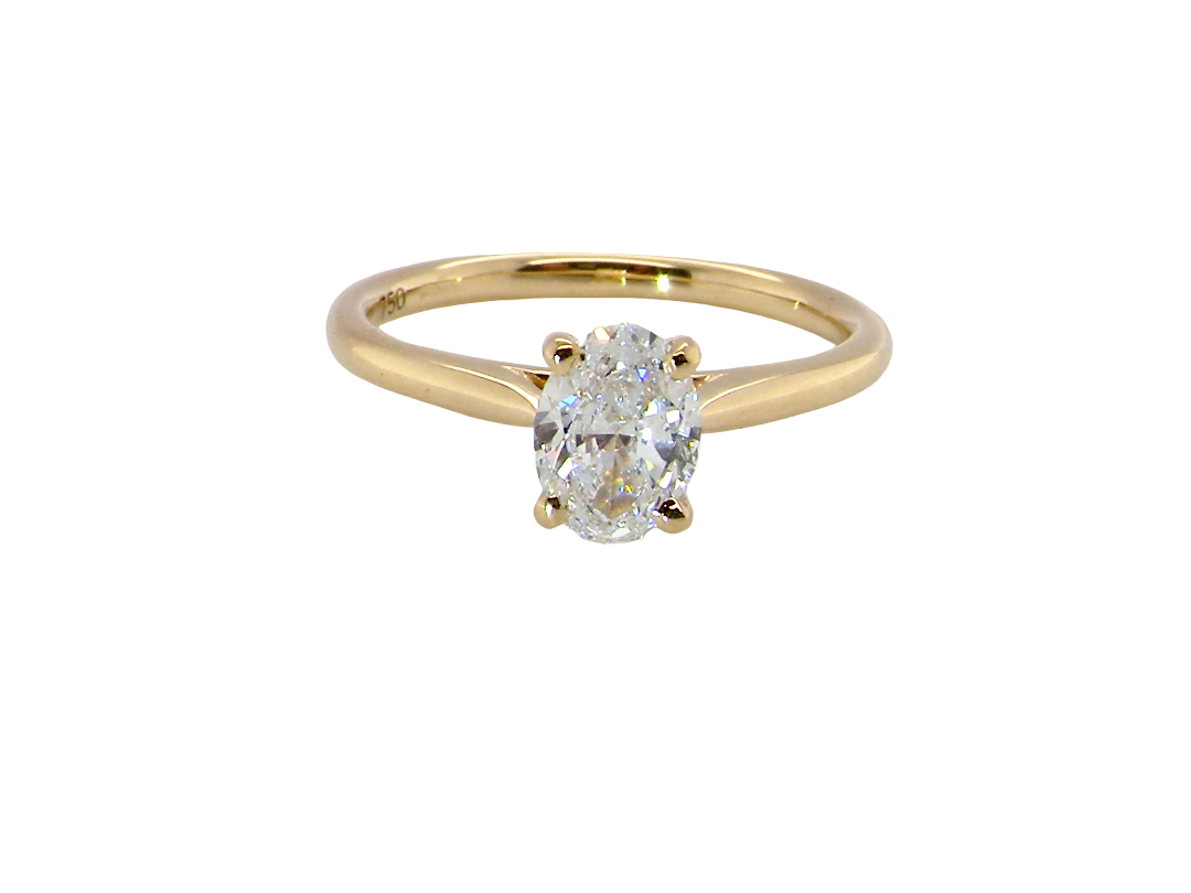 A brand new solitaire ring set with an oval brilliant cut white diamond. 