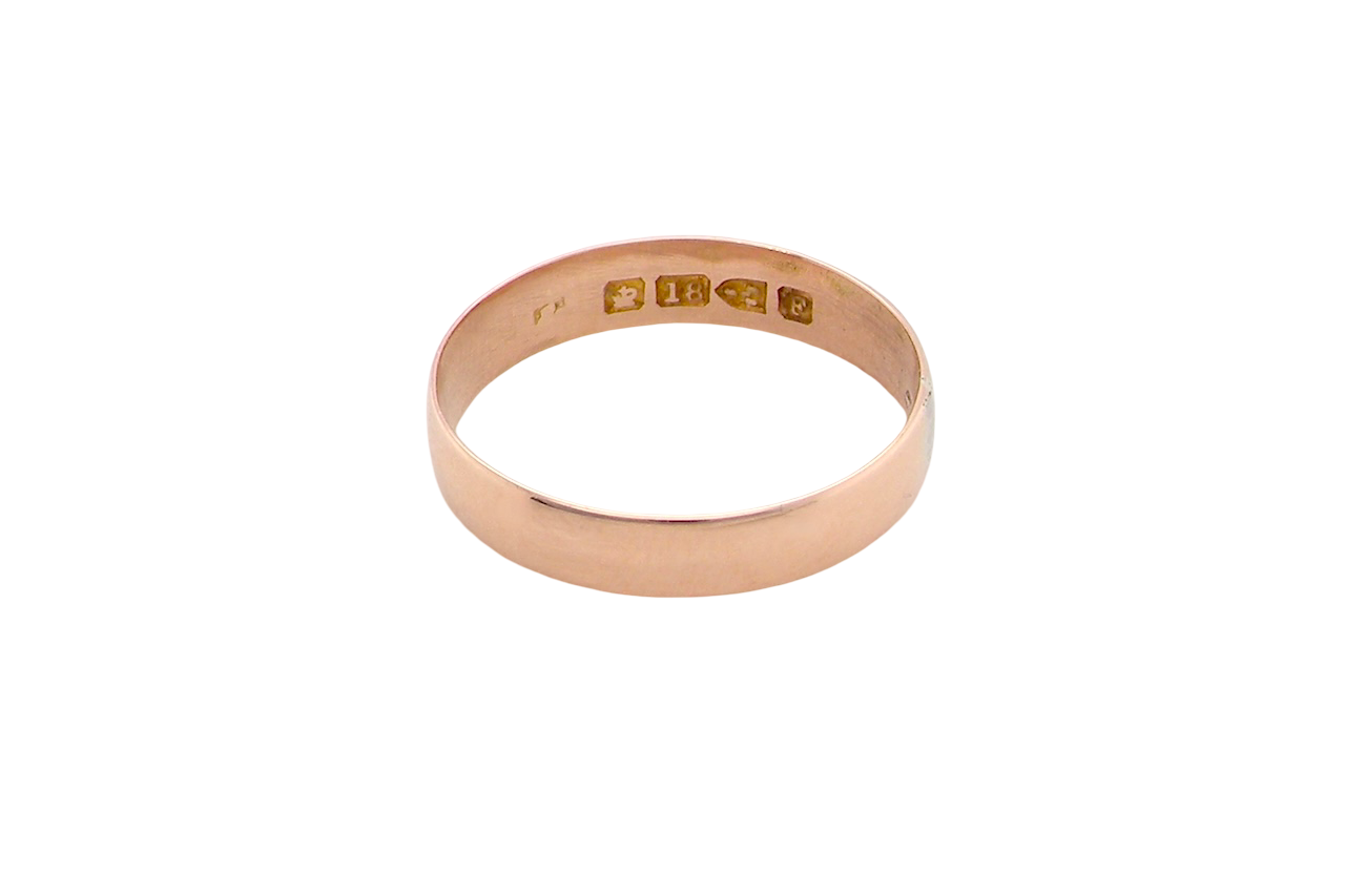 A classic 18 carat rose gold wedding ring.
Plain polished finish, 3.8mm wide. weight 2 grams.