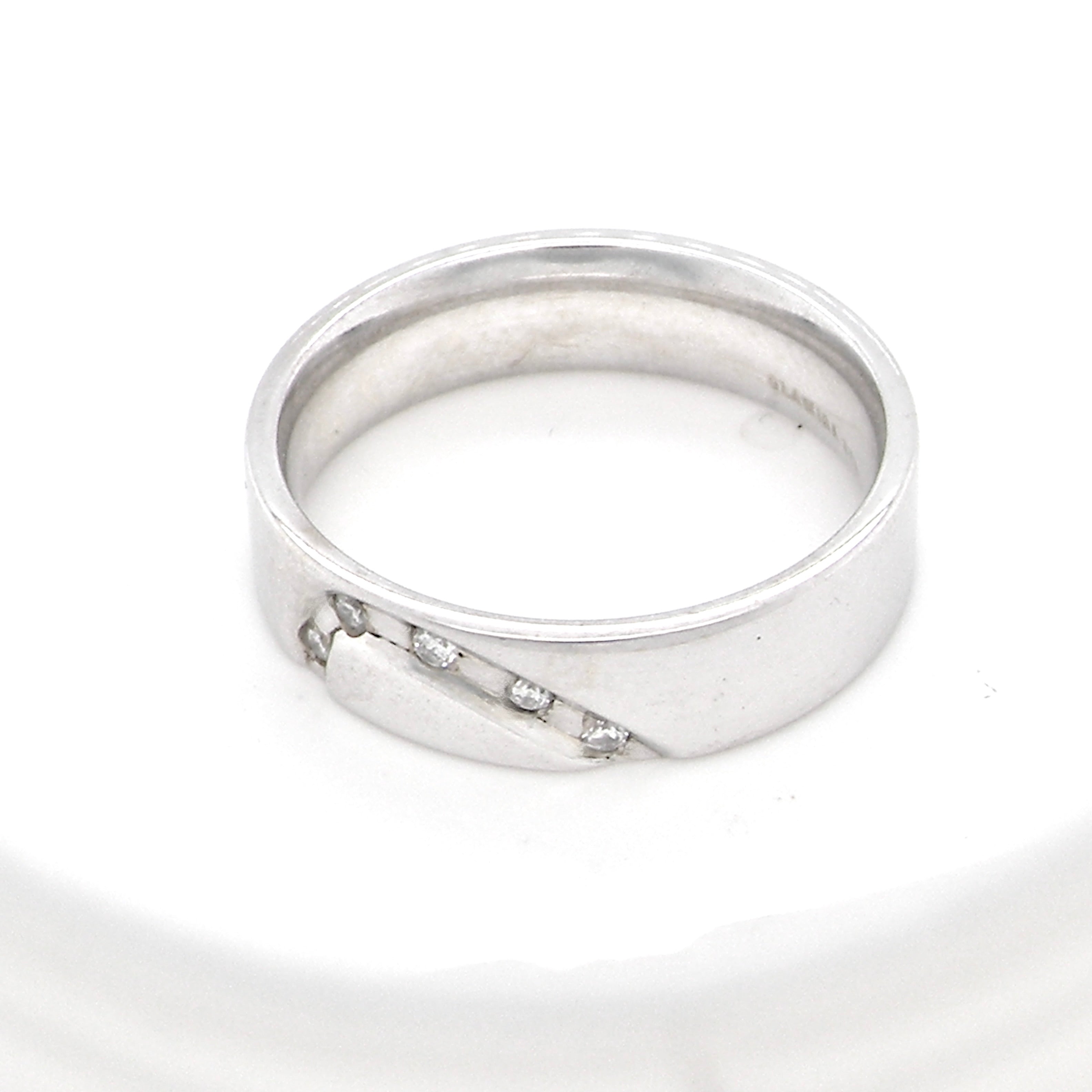 A classic 9 carat white gold ring with a timeless wedding-band style, equally suited to wear as a simple diamond dress ring.