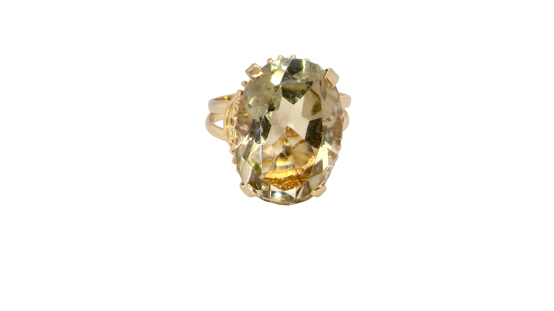 A continental dress ring that tests as 18 carat gold. Features a large citrine gemstone, that measures 18x13mm, depth 9mm. Golden yellow . 