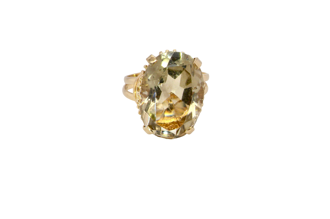 A continental dress ring that tests as 18 carat gold. Features a large citrine gemstone, that measures 18x13mm, depth 9mm. Golden yellow . 