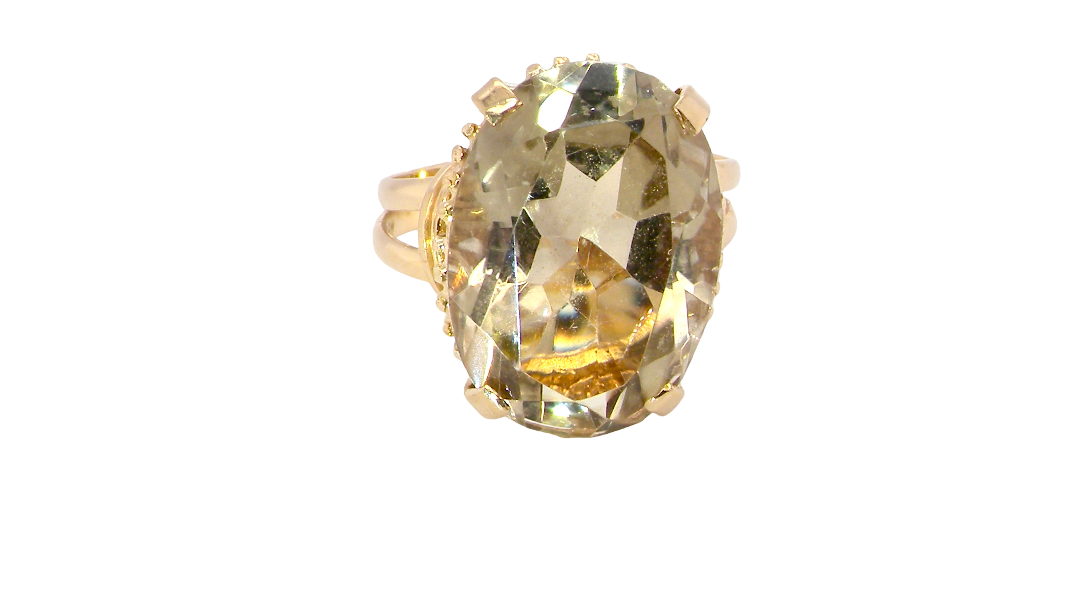 A continental dress ring that tests as 18 carat gold. Features a large citrine gemstone, that measures 18x13mm, depth 9mm. Golden yellow with a hint of olive green. 