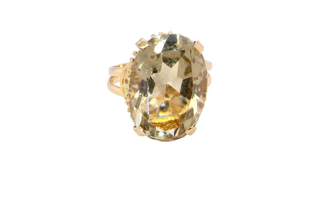 A continental dress ring that tests as 18 carat gold. Features a large citrine gemstone, that measures 18x13mm, depth 9mm. Golden yellow with a hint of olive green. 