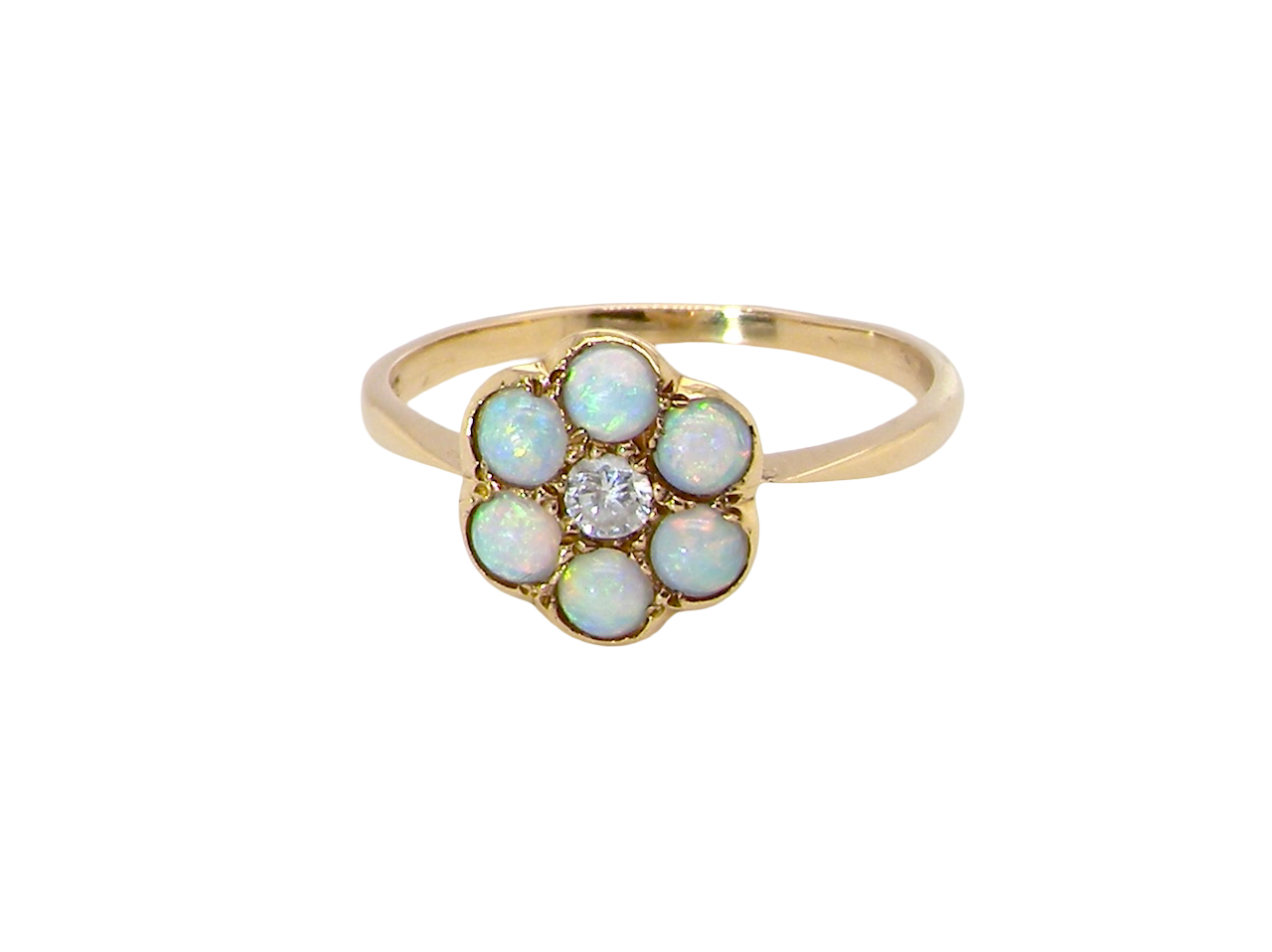 A daisy cluster dress ring. Set with a small diamond centre stone, diameter 3mm