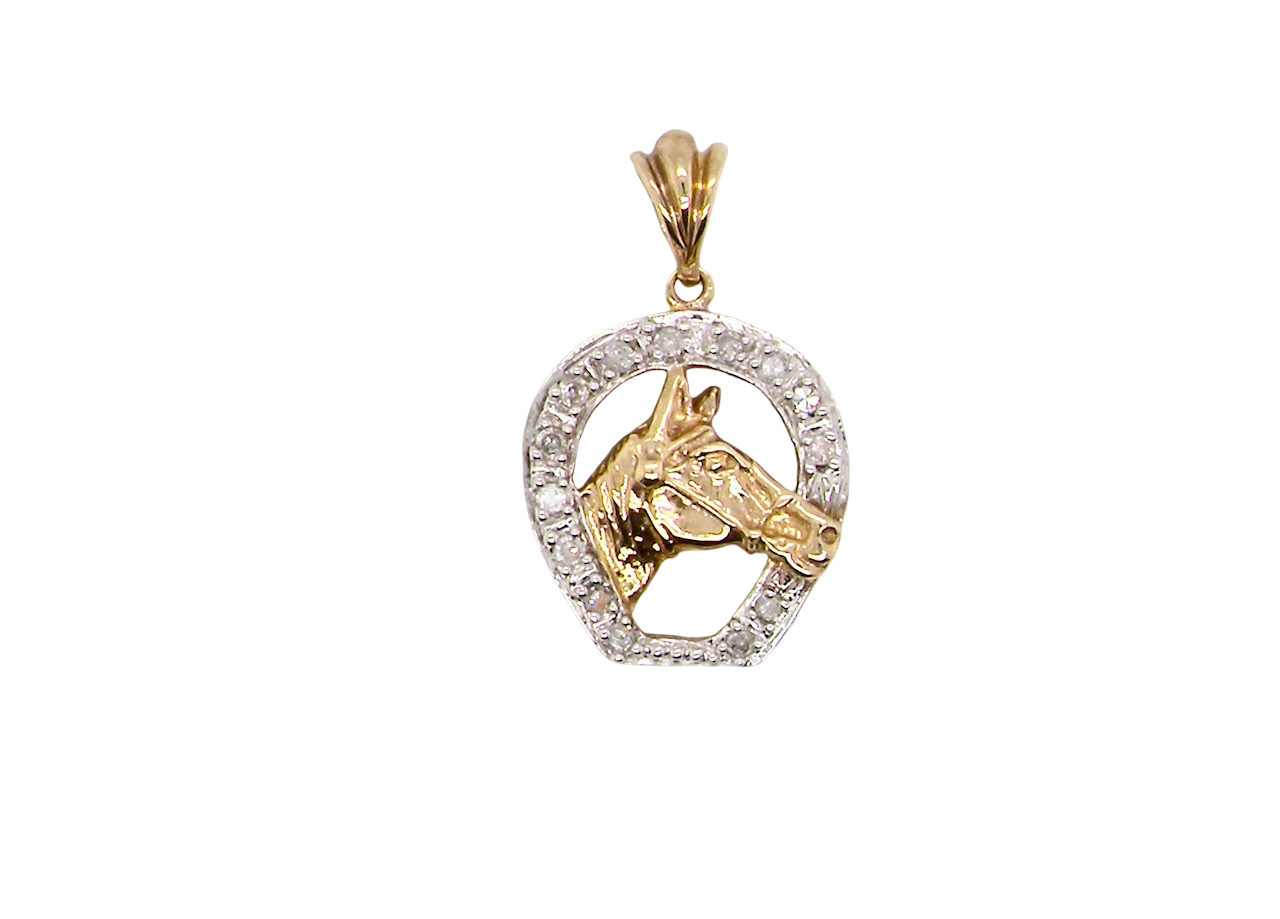 Gold and silver horse pendant on a white background