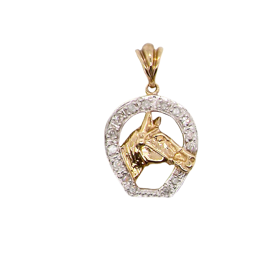 Gold and silver horse pendant on a white background