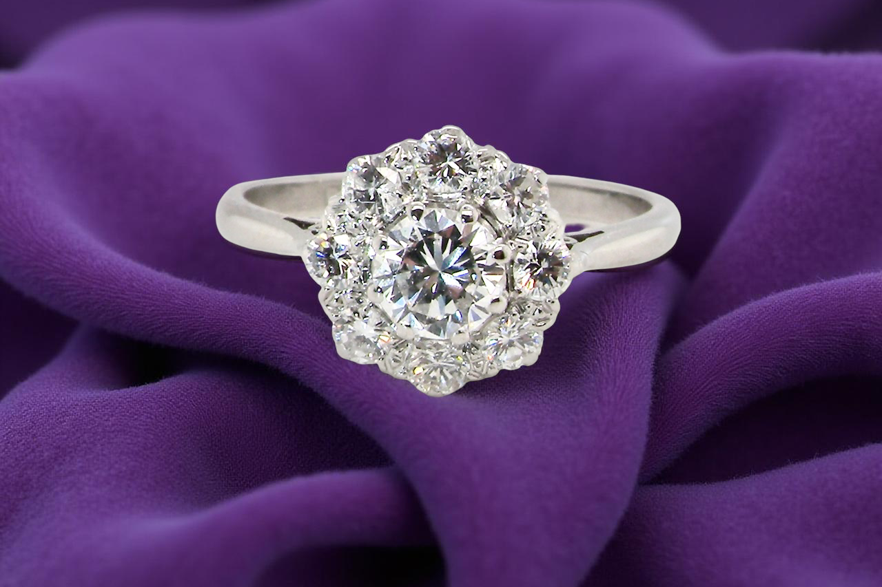 Diamond ring on a purple fabric background