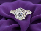 Diamond ring on a purple fabric background