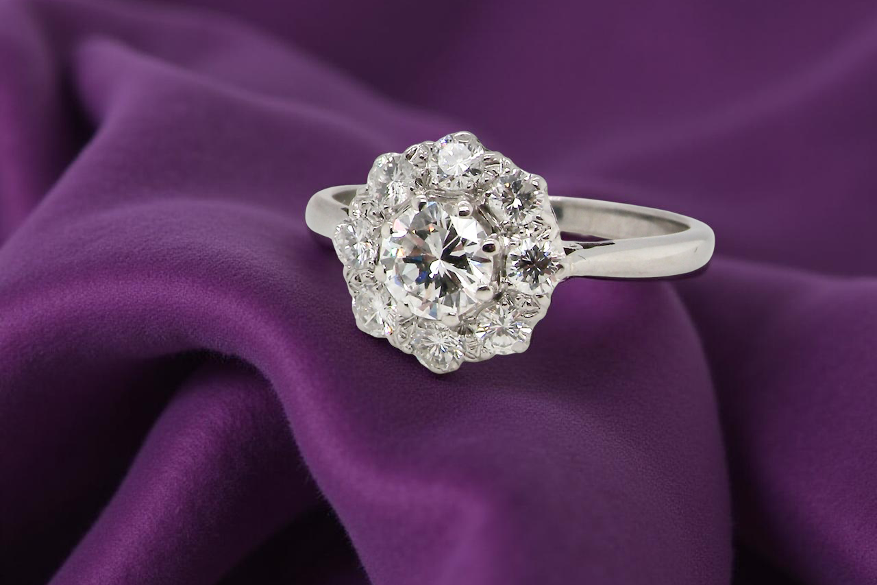 Diamond ring on a purple fabric background