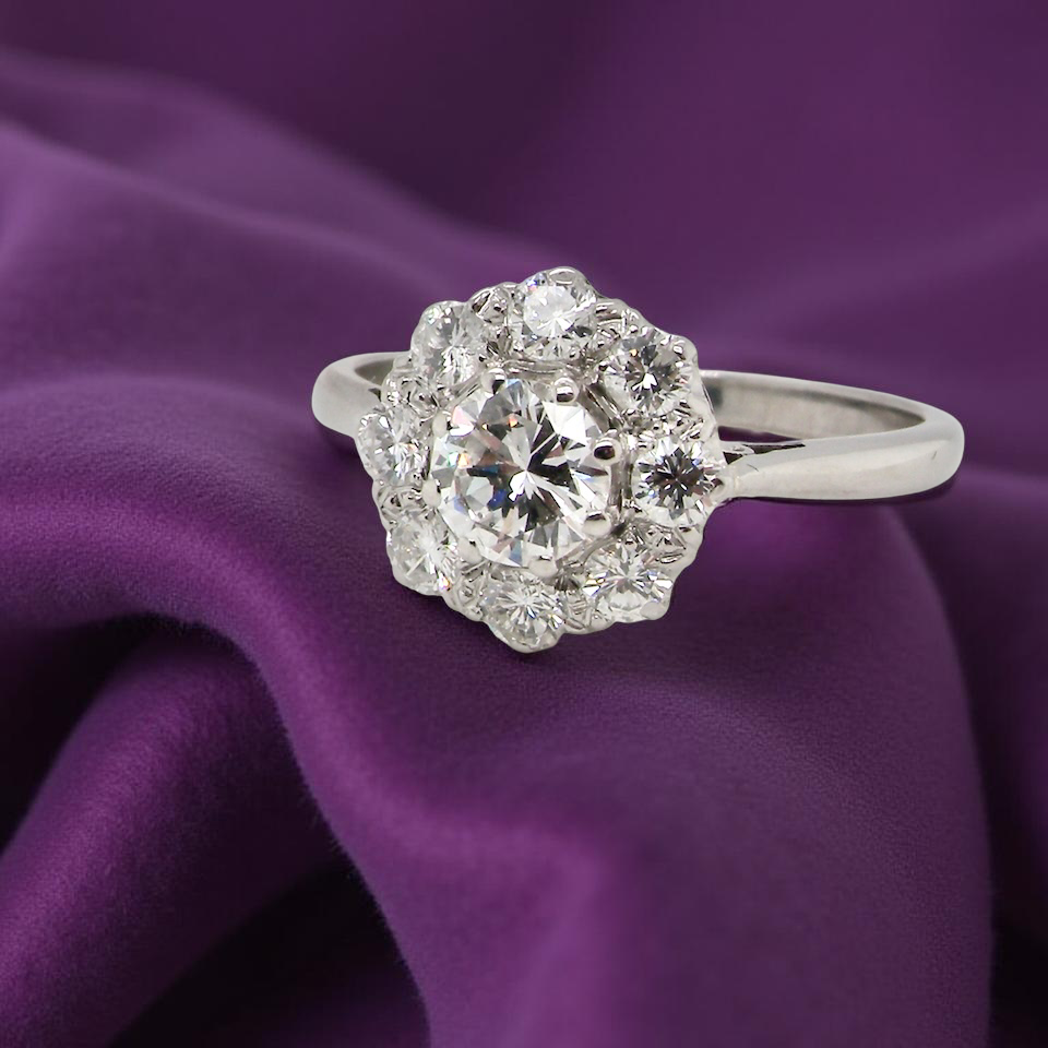 Diamond ring on a purple fabric background