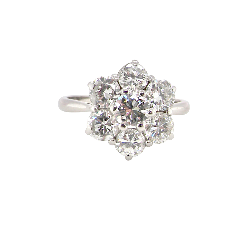 A fabulous vintage diamond cluster ring, beautifully crafted in 18 carat white gold and set with seven fine brilliant cut white diamonds.