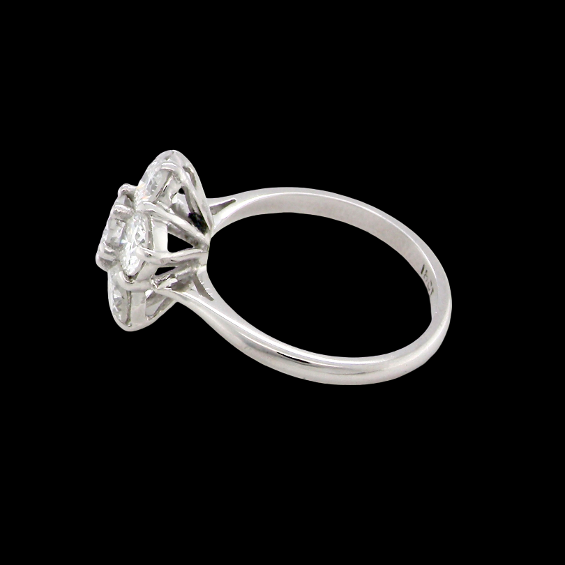 A fabulous vintage diamond cluster ring, beautifully crafted in 18 carat white gold and set with seven fine brilliant cut white diamonds. side