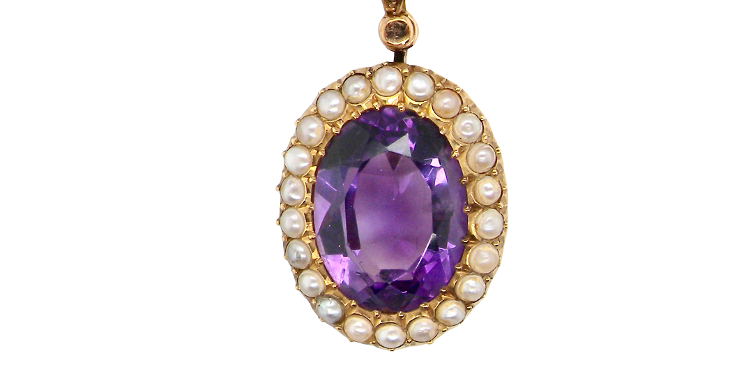 A fine 15 carat gold* pendant. features a large amethyst centre stone