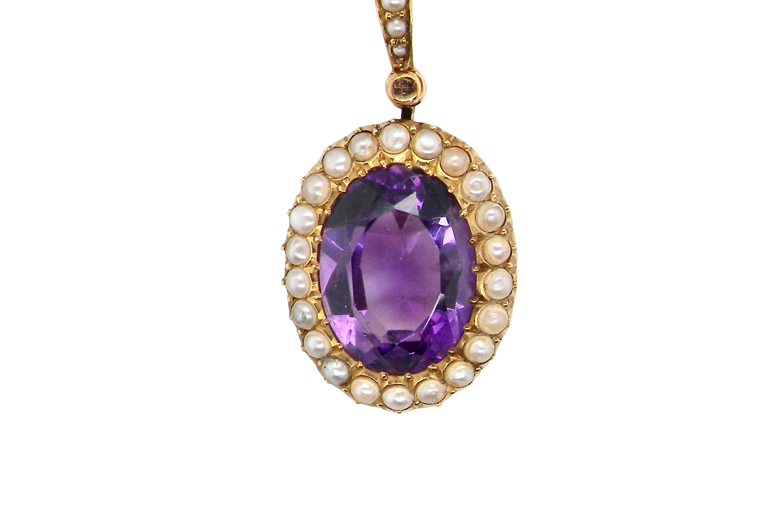 A fine 15 carat gold* pendant. features a large amethyst centre stone