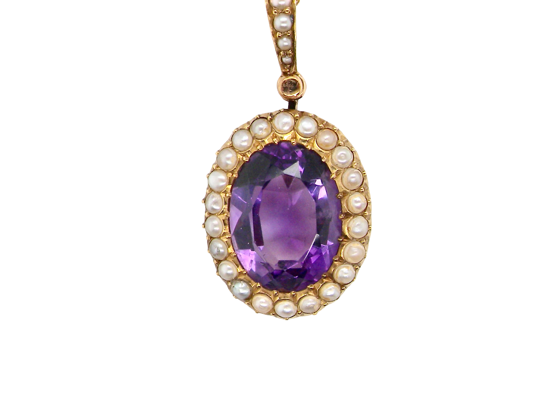 A fine 15 carat gold* pendant. features a large amethyst centre stone