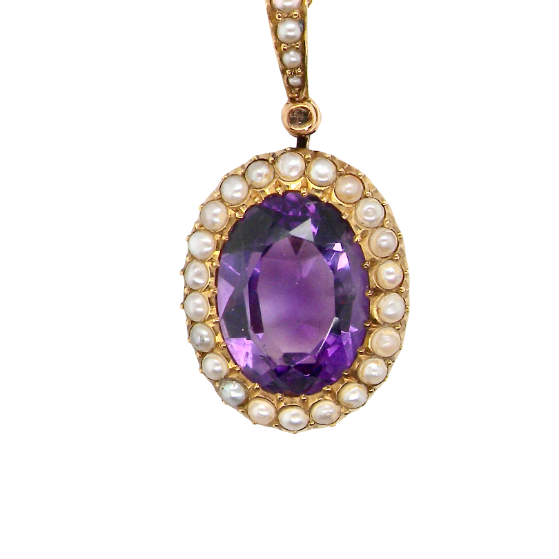A fine 15 carat gold* pendant. features a large amethyst centre stone