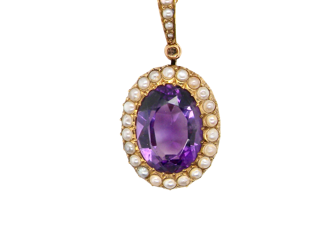A fine 15 carat gold* pendant. features a large amethyst centre stone