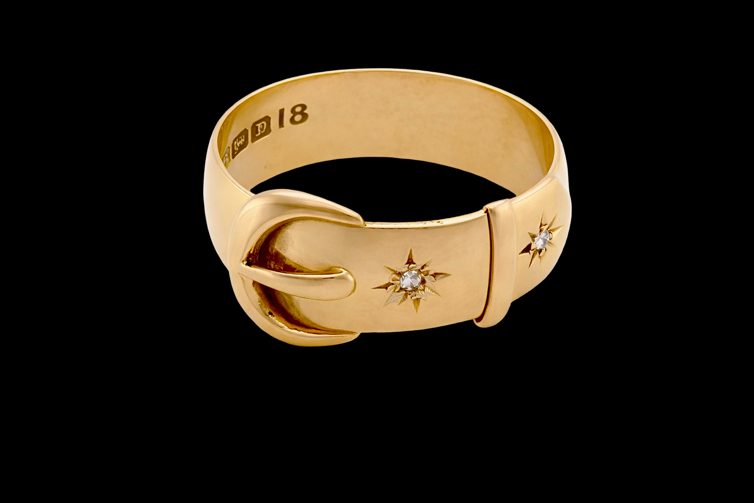 A fine 18 carat gold buckle ring set with old rose cut diamonds